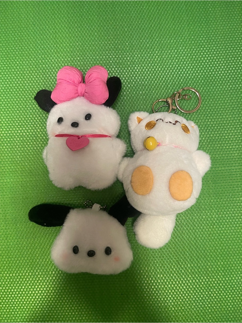 No Boundaries Plush Keychain Trio — White, Pink, Black, Yellow Accents